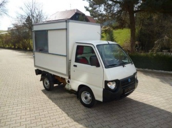 Müllaufbau mit Heckplane