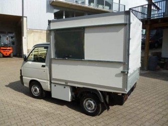 Müllaufbau mit Heckplane