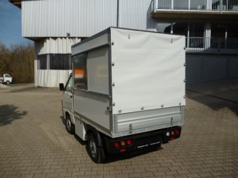 Müllaufbau mit Heckplane