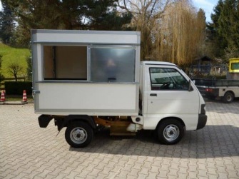 Müllaufbau mit Heckplane