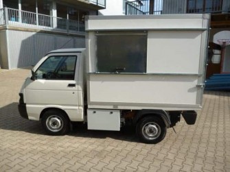 Müllaufbau mit Heckplane